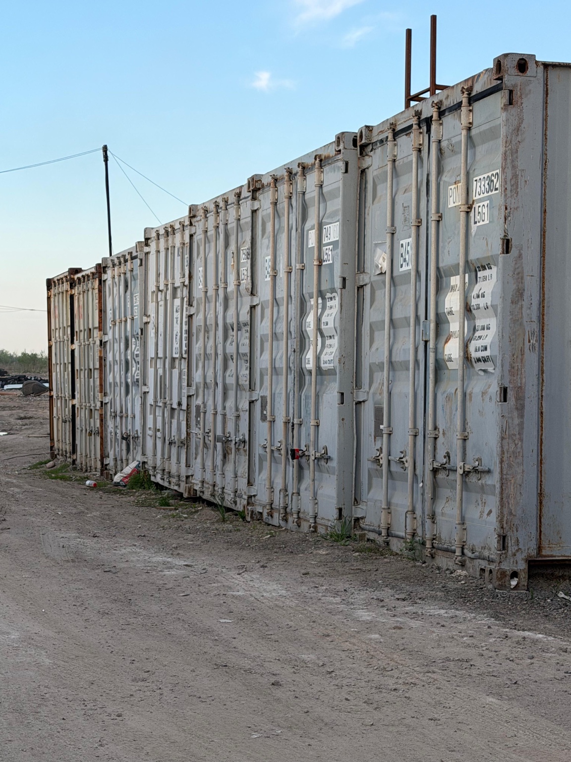 Light-colored containers at the AR Rent site